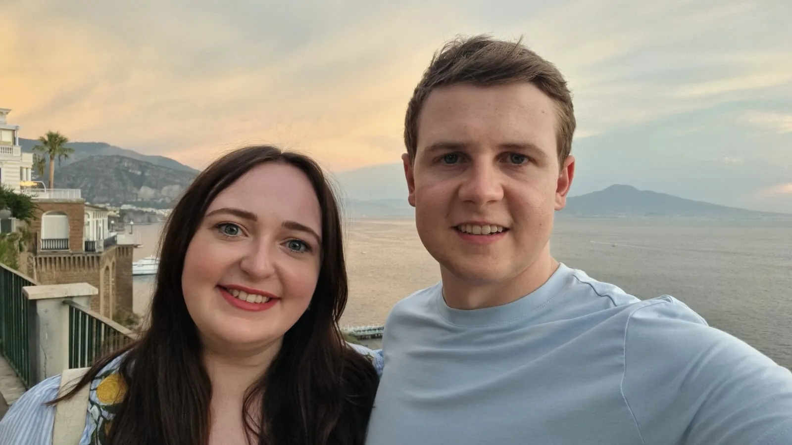 Jordana and Mark by the sea at sunset